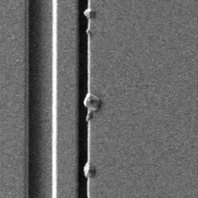 Image of crystal growth at the edge of a wafer pattern